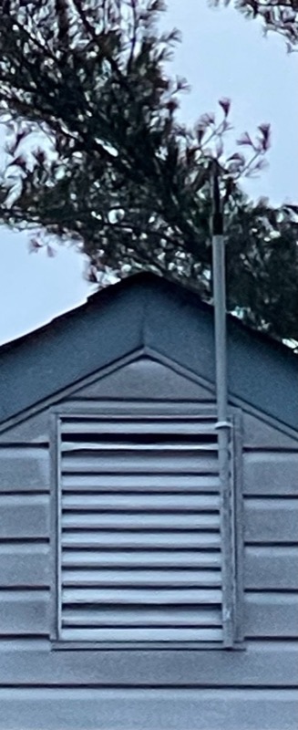 Attic vent antenna mast mount installed